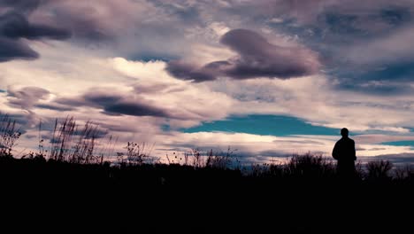 beautiful black silhouette outline of a male jogger, jogging against a dramatic sky