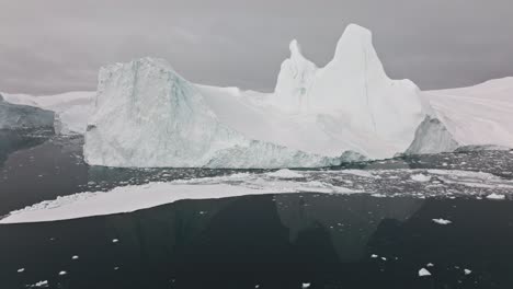 drone over sea and ice of ilulissat icefjord