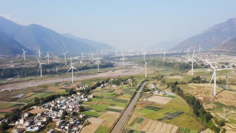 drone shots of a large chinese windfarm located in the valley of sichuan