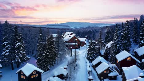 snowy mountain village at sunset