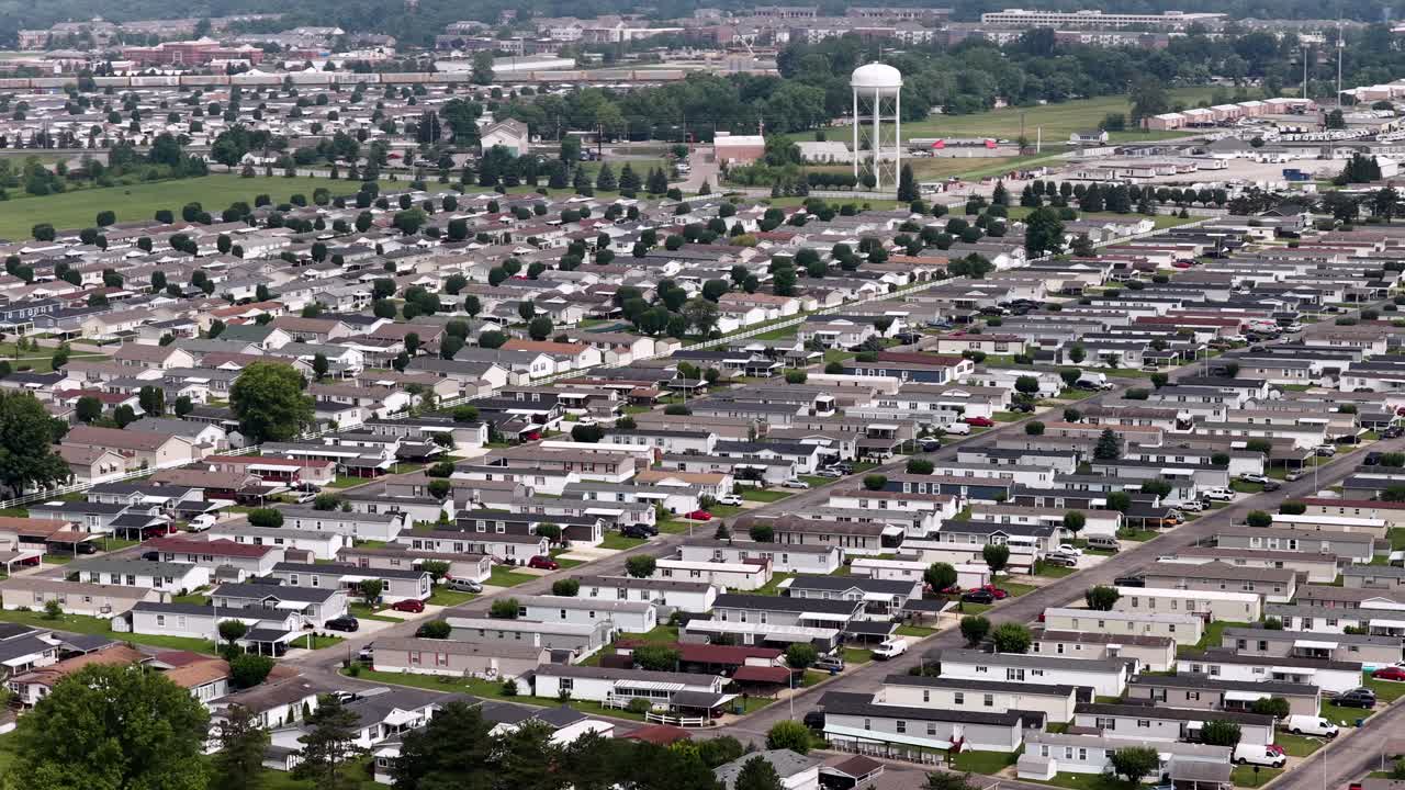 Overhead aerial of neighborhood streets in Indiana with lush green lawns and clean streets