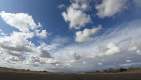 cloud time lapse over empty desert plain in california