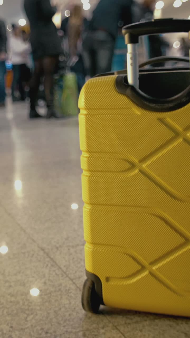 Yellow Suitcase at the Airport