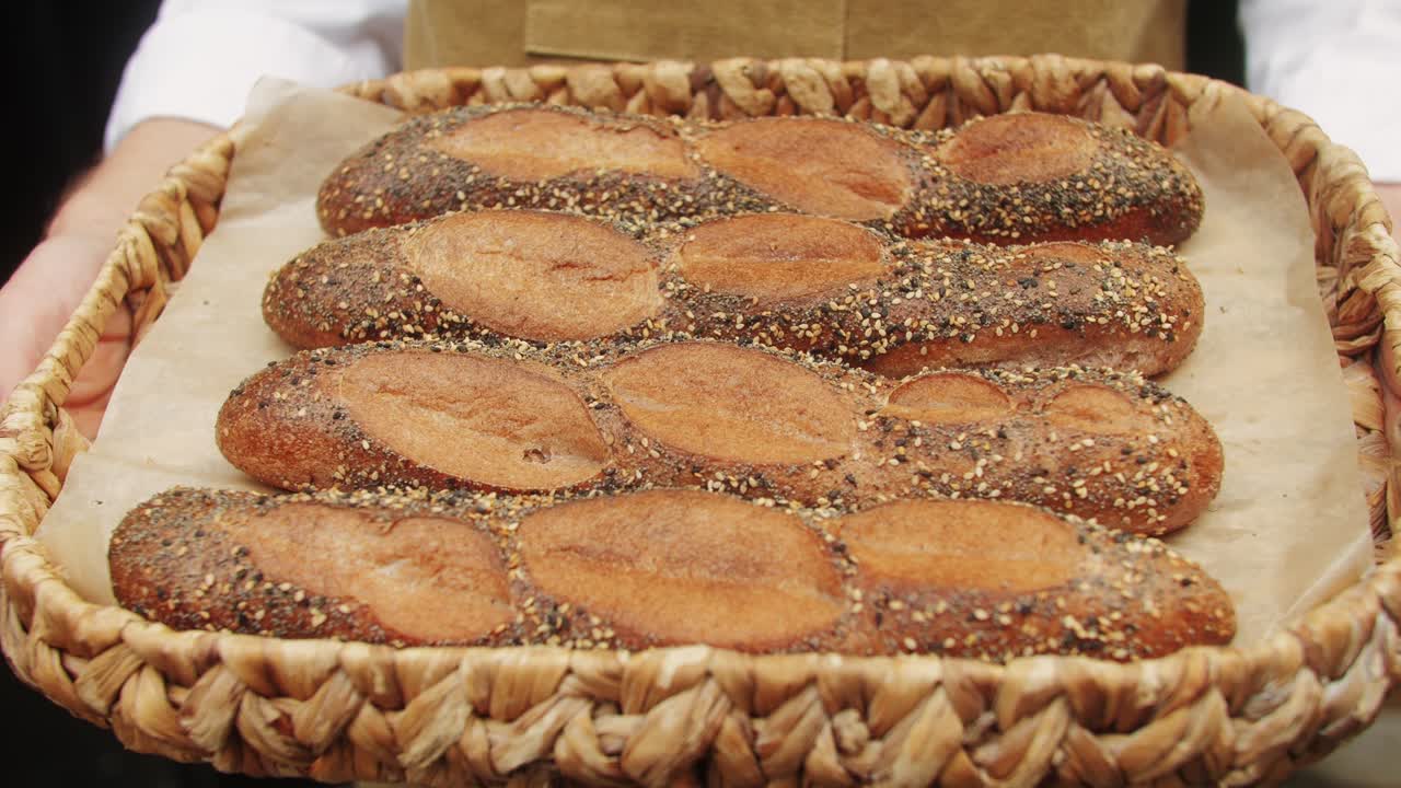 Fresh Artezan bread close-up. Artisan bread is making by skill bakers using natural and high-quality ingredients. Food with health and flavour benefits. Bakery shop and market