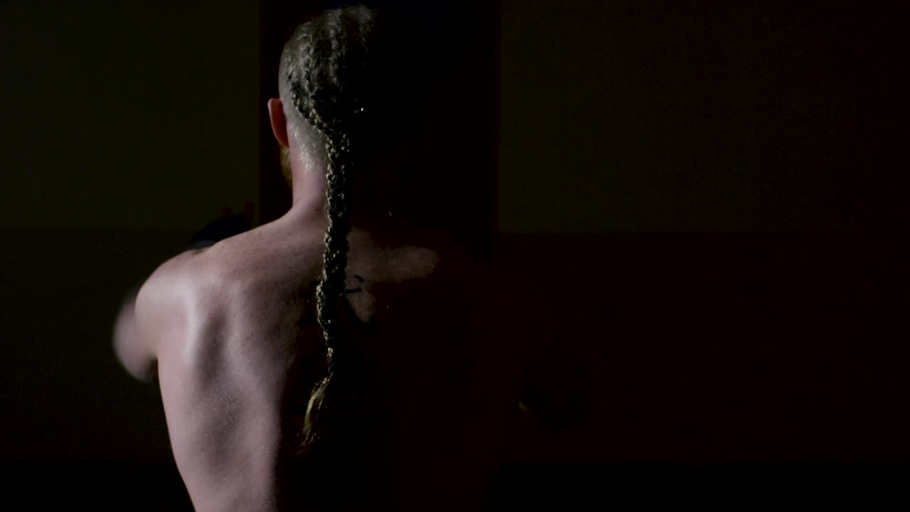 Man practicing Muay Thai in a gym