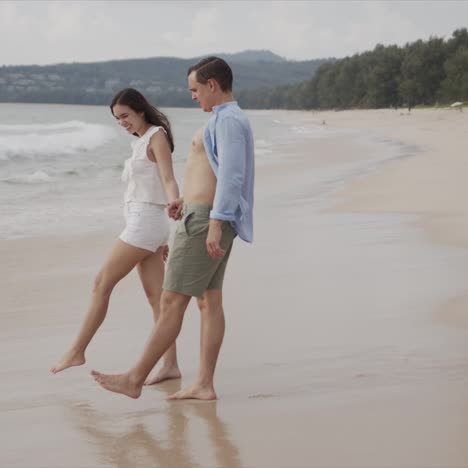 happy couple tourists having fun enjoying in sea beach