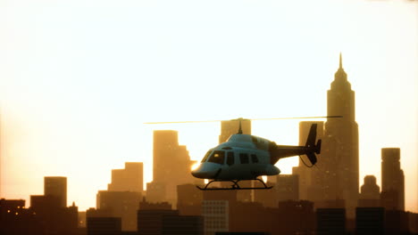 Silhouette-helicopter-at-city-scape-background