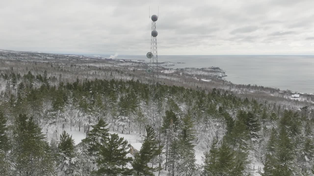 Self-Support Cell Tower Within The Snowy Forest In Winter. - aerial shot
