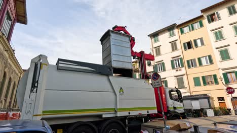 garbage truck lifting and emptying waste container