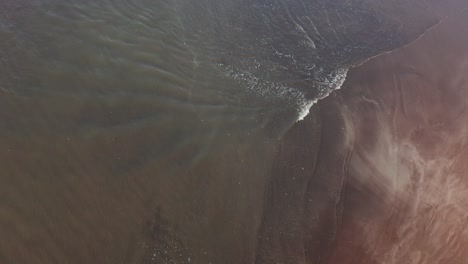 aerial view of beach waves splashing in maharashtra, india