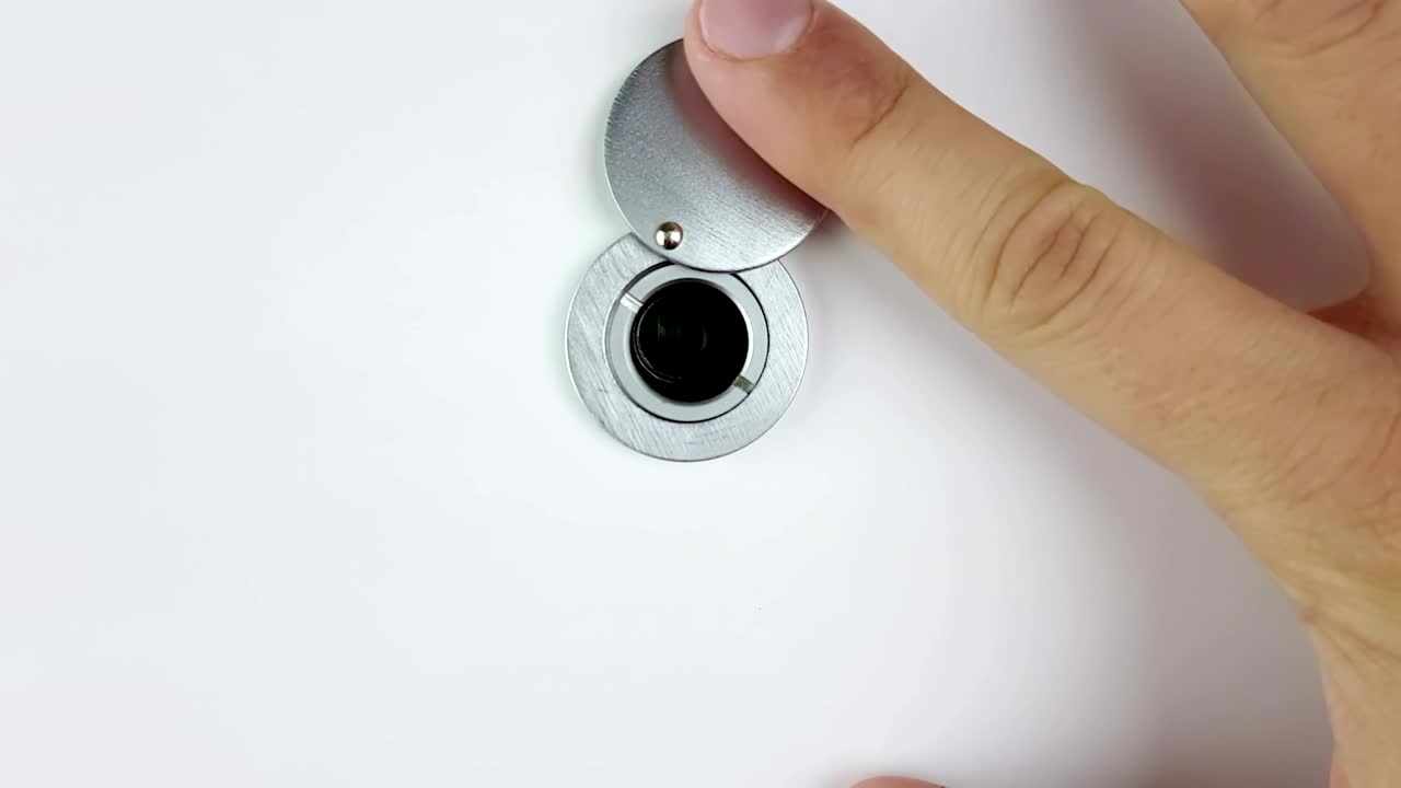 man looks by the house or hotel peephole of door with hand and see in the hyper speed space with final chroma key green screen, zoom in and zoom out camera movement, future technology and space exploration