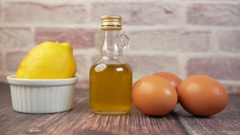 eggs ,oil and lemon on table ,