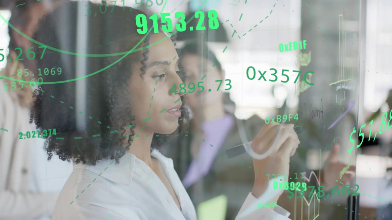Analyst writing on glass wall, colleague pointing and sparking green finance charts for team plans