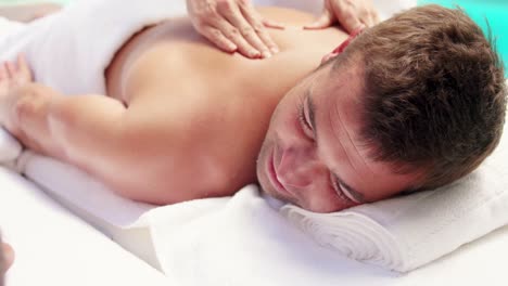 Man-receiving-a-back-massage-