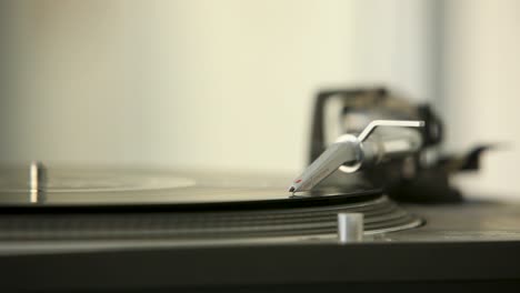 classic lp player - close up of rotating vinyl record playing music