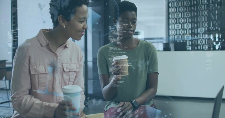 Two tech colleagues tapping transparent partition, swiping holographic data panels for data review