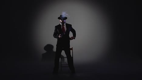 dramatic portrait of a man in a suit and fedora