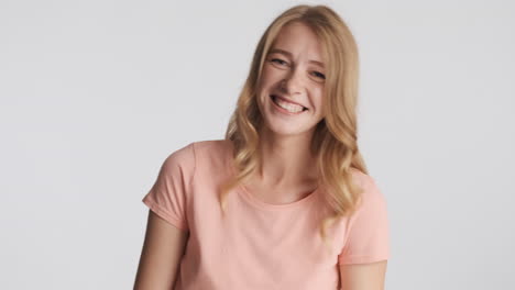 caucasian woman laughing on camera.
