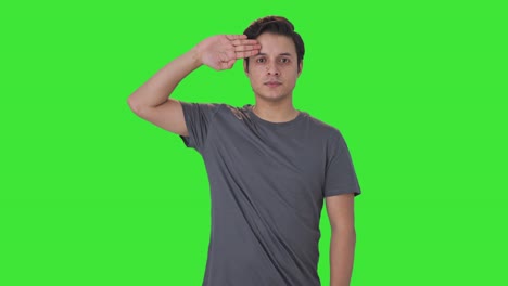 proud indian man saluting on camera green screen