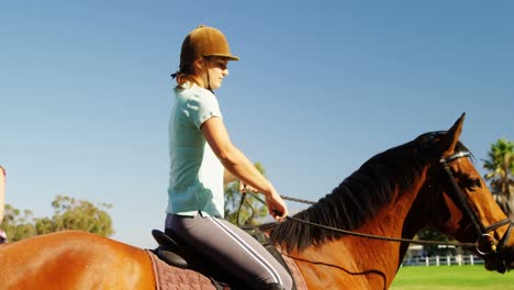 Friends-riding-horse-in-ranch-4k