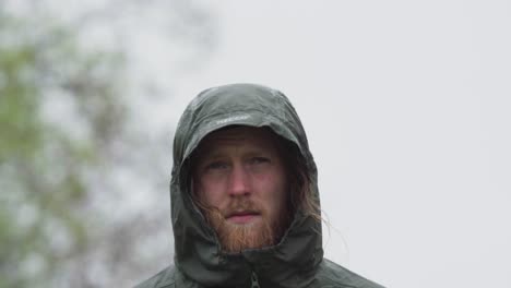 european man in hoodie jacket standing outdoor. closeup