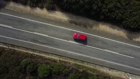 countryside asphalt road with moving cars, aerial top down view