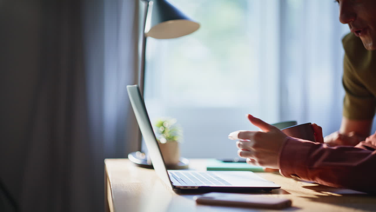 Laughing sweethearts watching laptop family morning closeup. Couple having fun