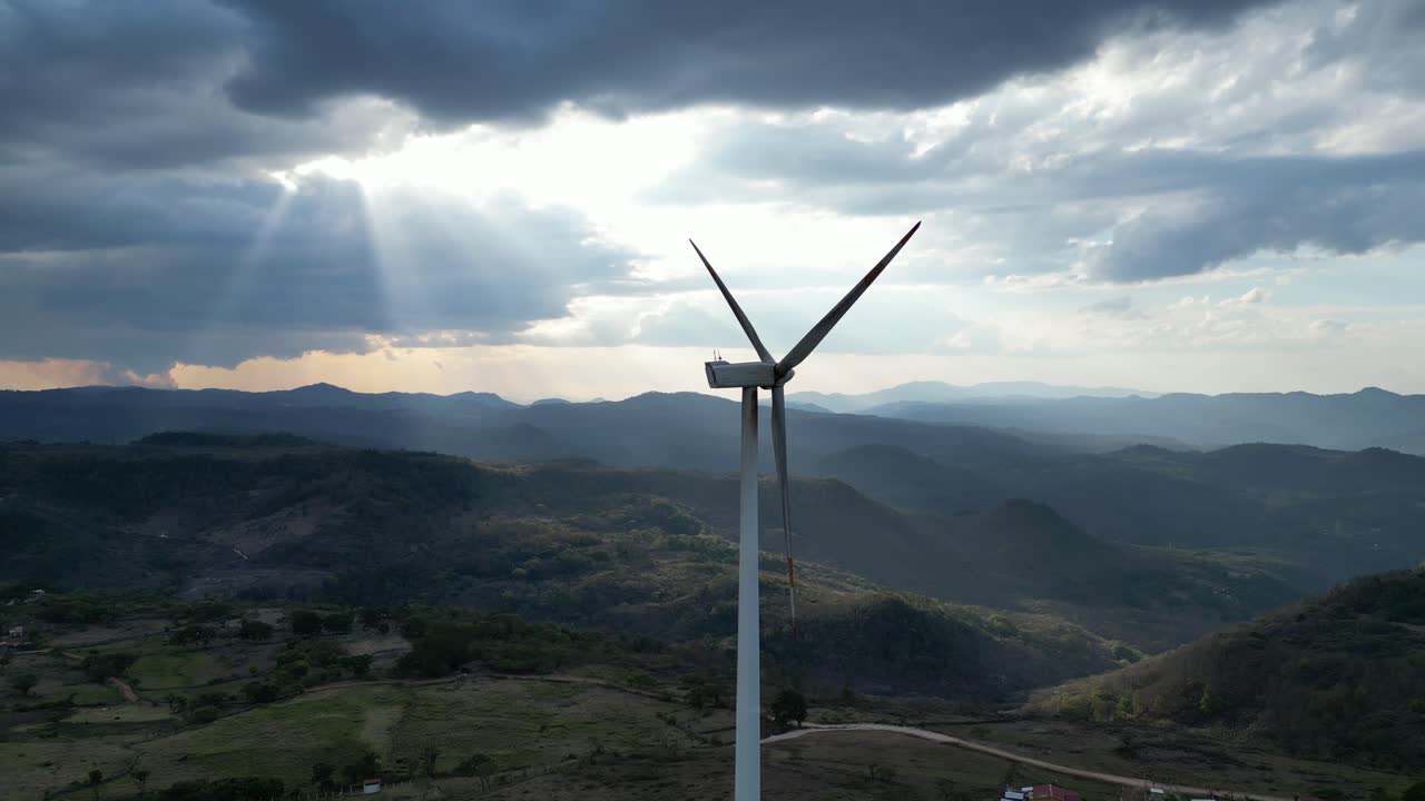 Majestic Wind Turbine Towering Over Rolling Hills, Sustainable Future and Eco Power