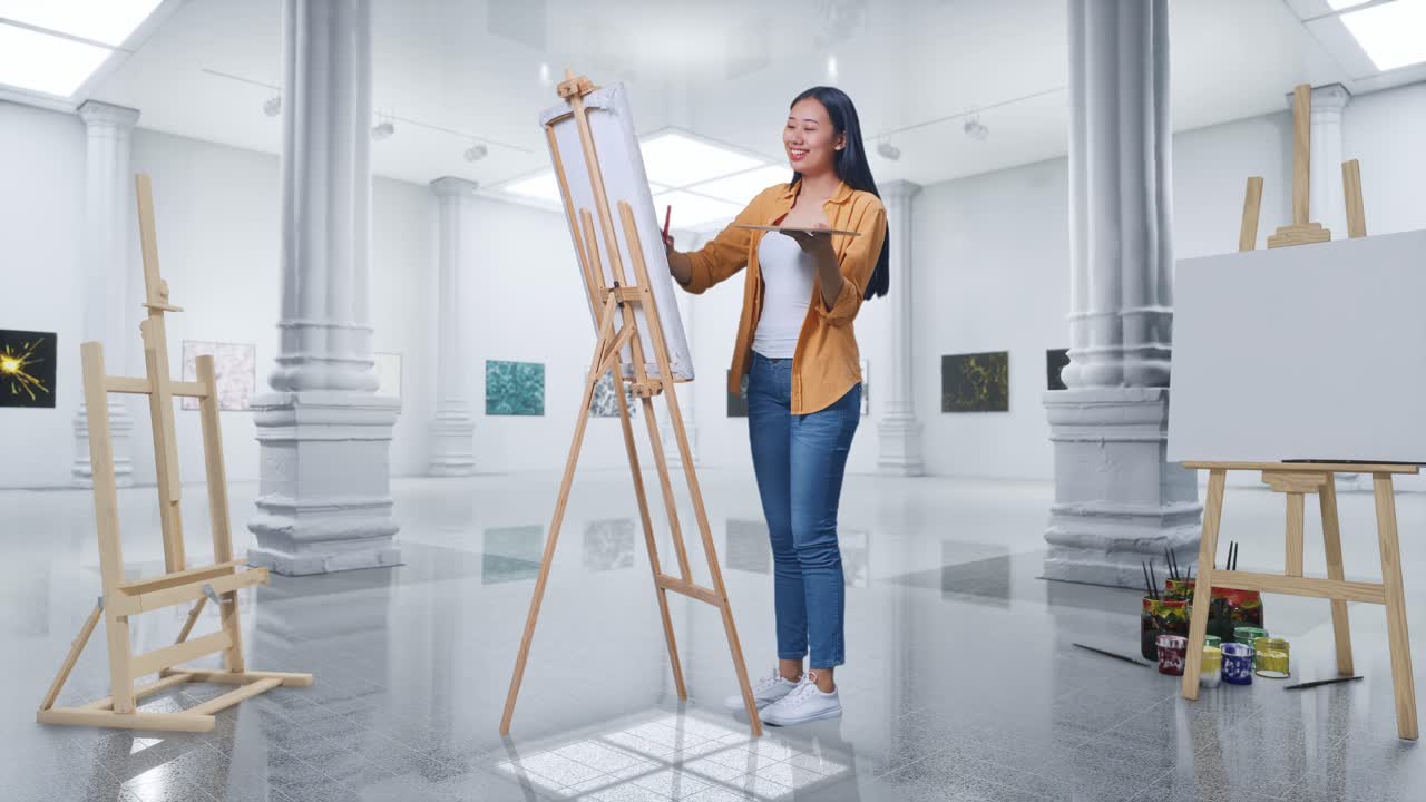 Full Body Of Asian Female Artist Smiling To Camera While Painting On Canvas By Oil Paints And Brush In Gallery