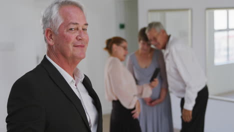 caucasian senior man spending time in a ballroom