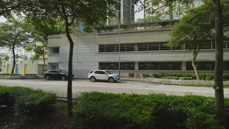 streets alive: awe-inspiring gimbal shot showcasing hong kong residential area and flowing traffic