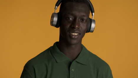 african american man on yellow background.