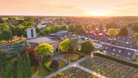 sunset over a peaceful garden. golden sunset bathes the lush garden in warm hues, surrounded by houses and trees, creating a tranquil vibe