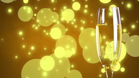 animation of glass of champagne on yellow background