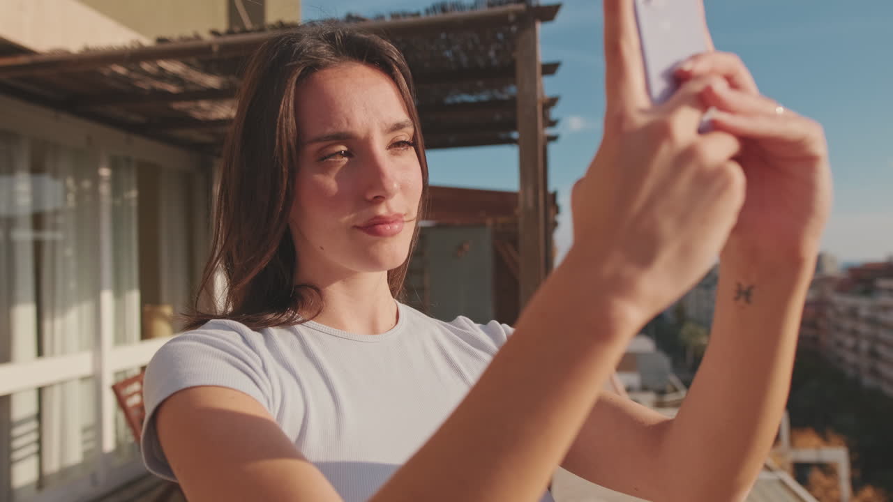 Woman taking a selfie on a rooftop