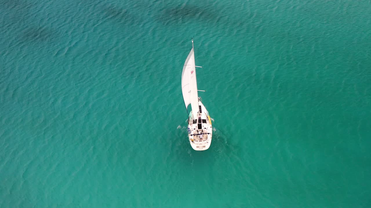 Boating - White Sailboat Cruising On Calm Blue Sea At Daytime Near The Bahamas In Caribbean. - aerial