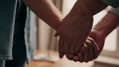 close-up of hands holding: a symbol of connection and support
