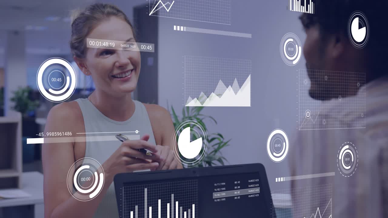 Reviewing charts, woman taking notes while animated data graphs hovering laptop in business meeting
