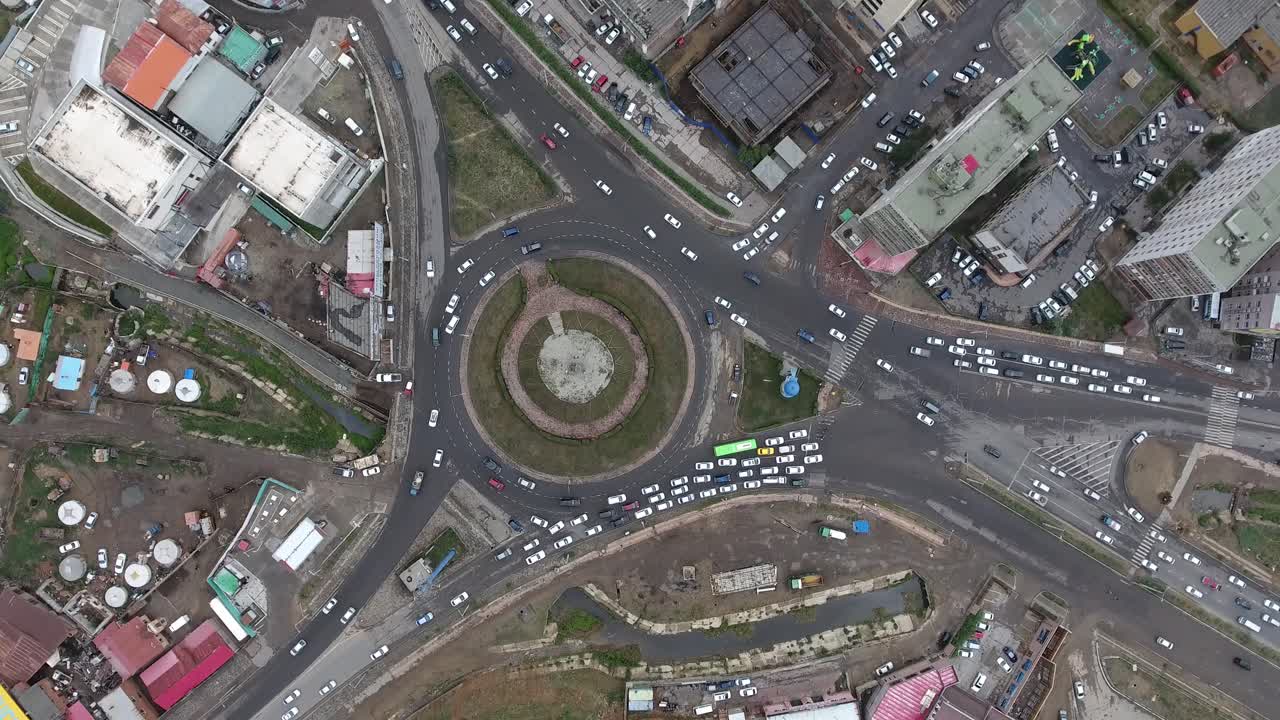 Aerial drone shot roundabout from top view in Ulan Bator Mongolia traffic time