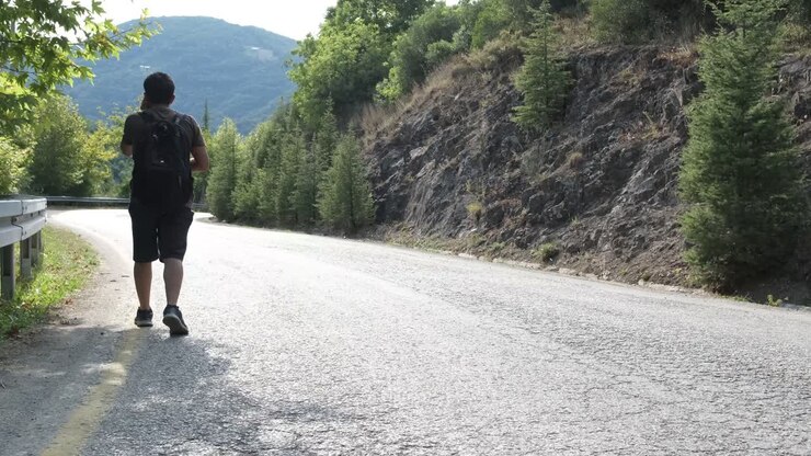 Man Trekking Asphalt