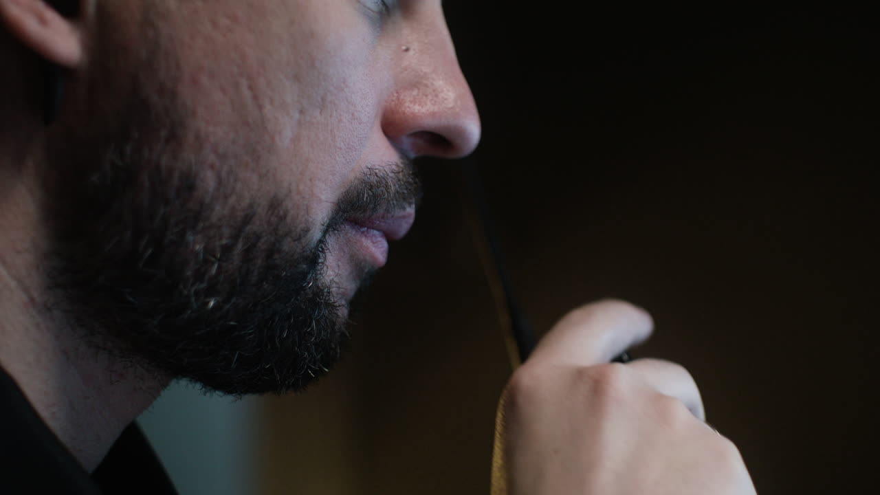 Caucasian man using walkie talkie