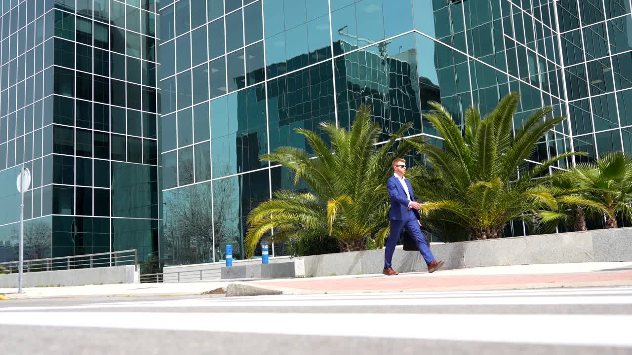 A businessman in a suit walking in an urban environment