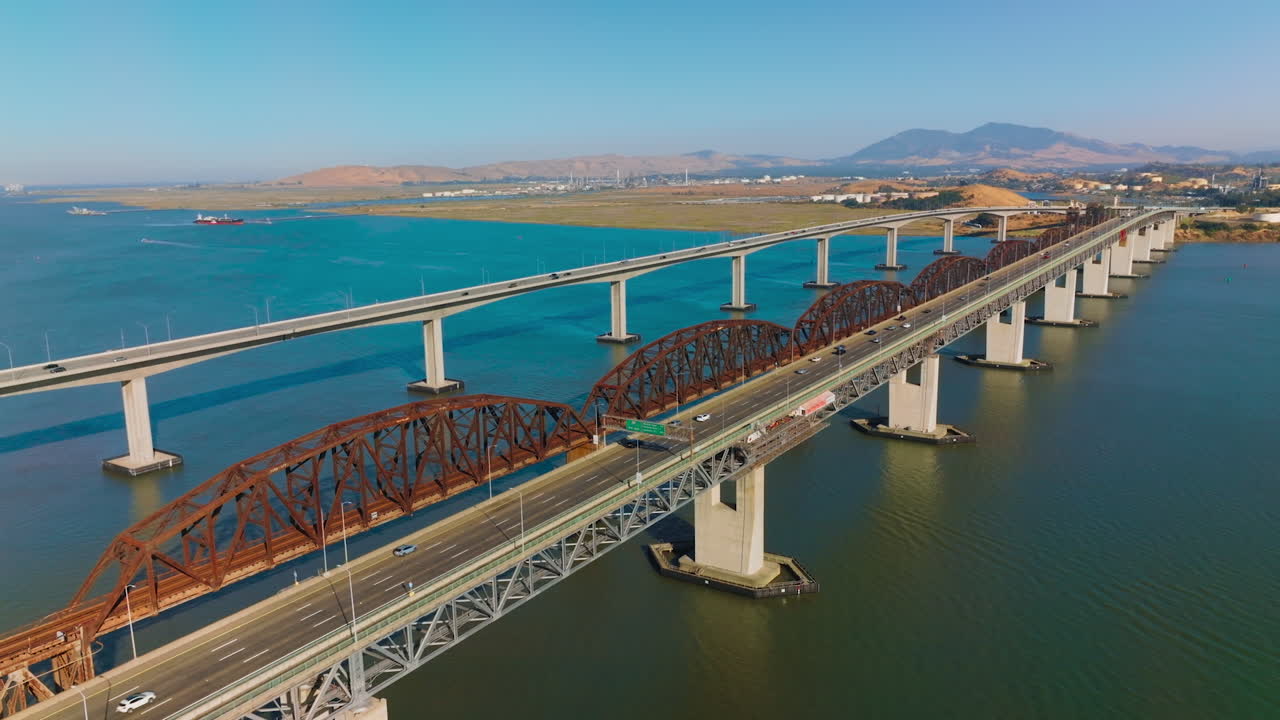 Aerial View of a Long Bridge Spanning a River