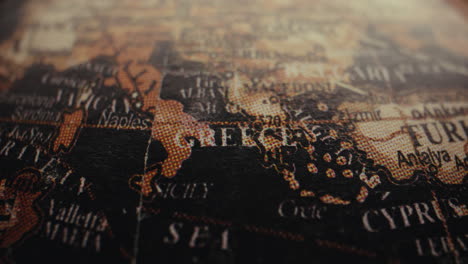 close-up of a vintage world map focusing on greece