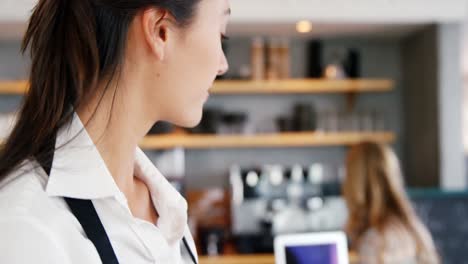 smiling woman using digital tablet