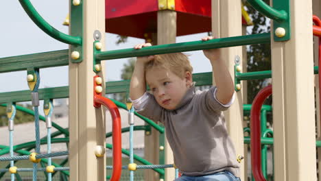 boy on playground equipment