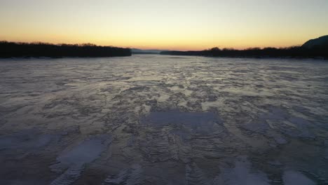 frozen river at sunrise/sunset