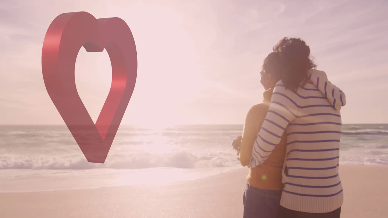 Couple embracing on beach with heart-shaped location pin animation over scene