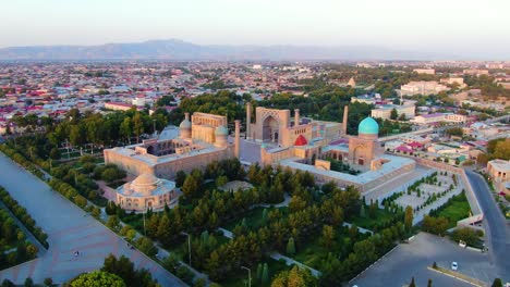 medieval with architectural structures surrounded on main square of registan in samarkand, uzbekistan