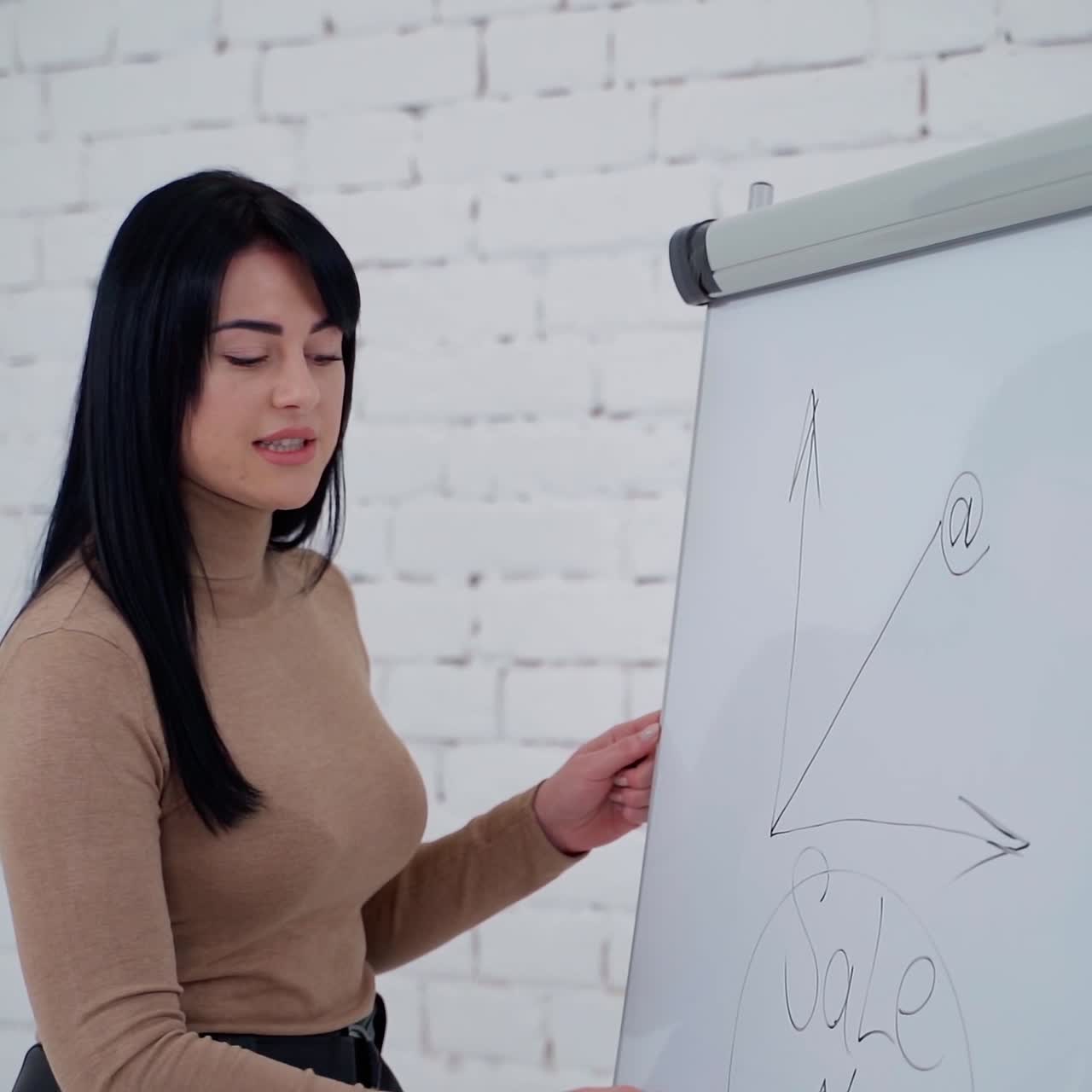 . Businesswoman working with board. Young beautiful businesswoman with marker writing on whiteboard